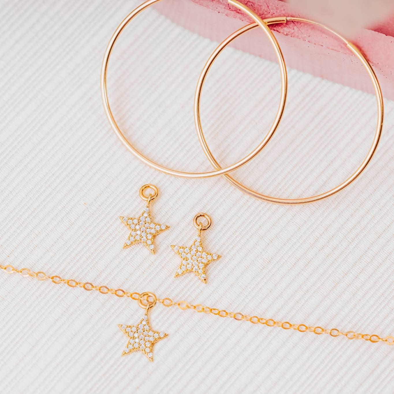 GOLD STAR HOOP EARRINGS