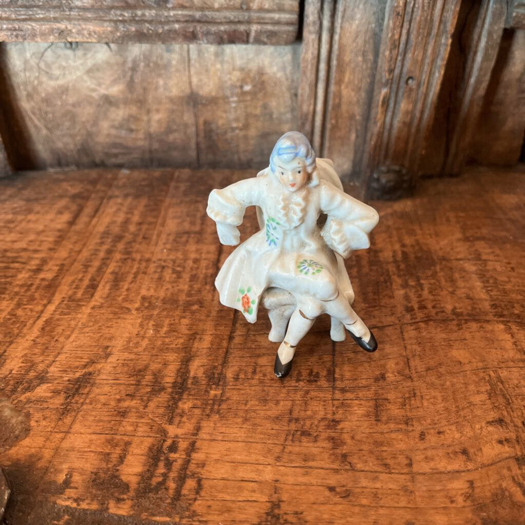 COLONIAL SITTING MAN FIGURINE