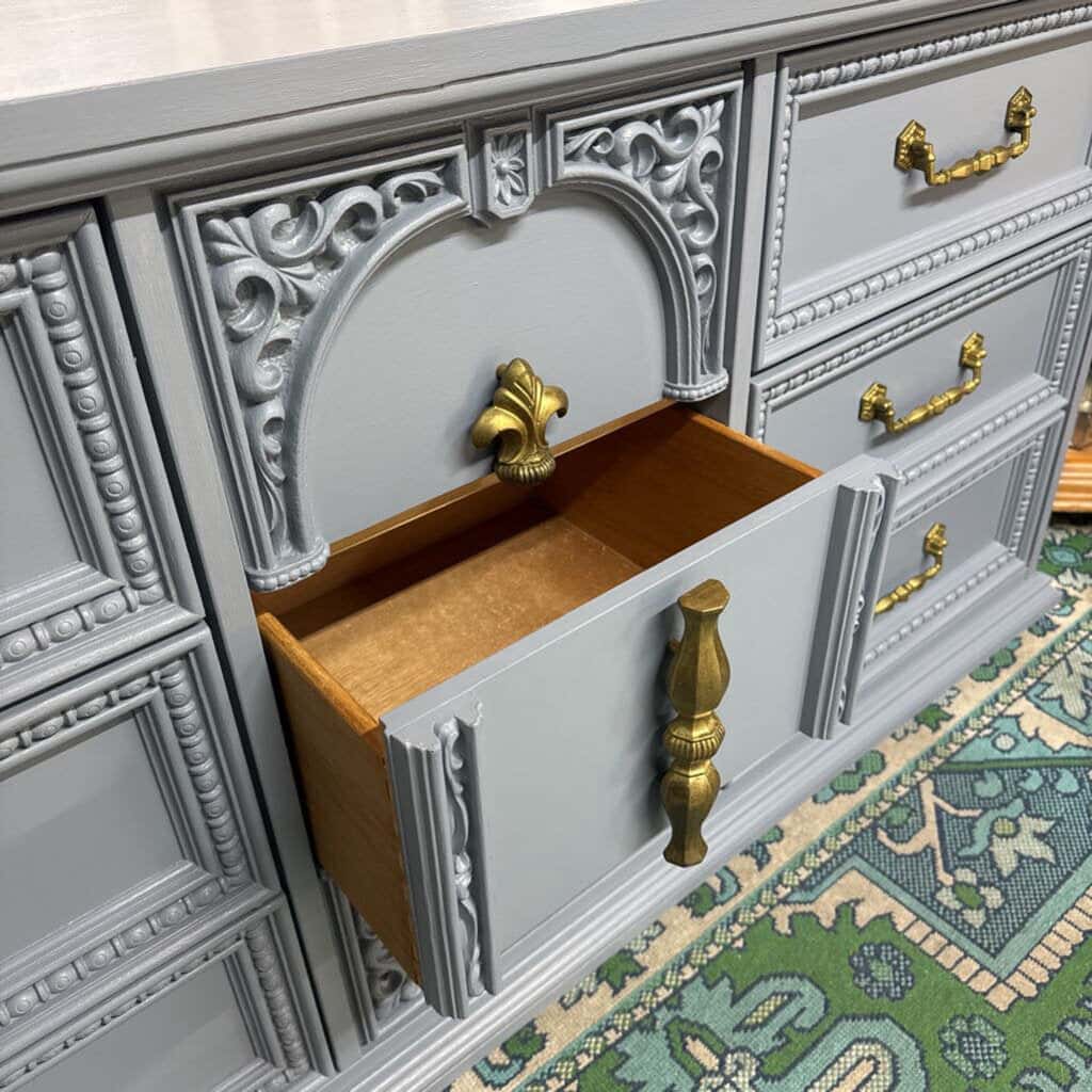 GREY BASSET 9 DRAWER WOODEN DRESSER