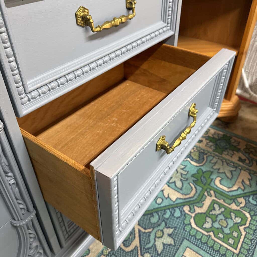 GREY BASSET 9 DRAWER WOODEN DRESSER