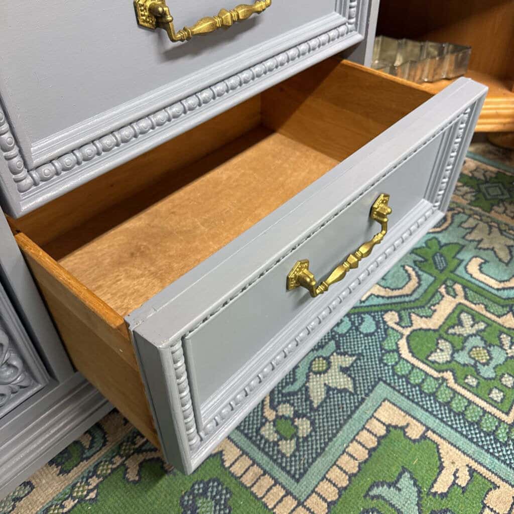 GREY BASSET 9 DRAWER WOODEN DRESSER