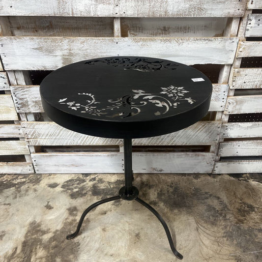 ROUND BLACK OUTDOOR TABLE WITH DECORATIVE CUTOUT DESIGN