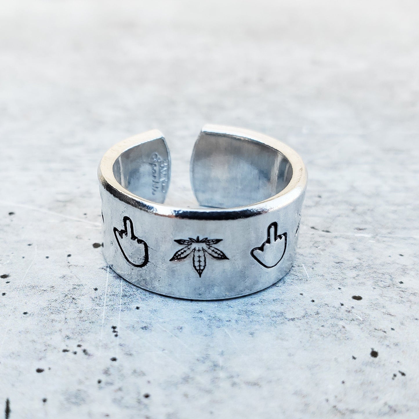 MIDDLE FINGER HEMP LEAF WIDE BAND RING