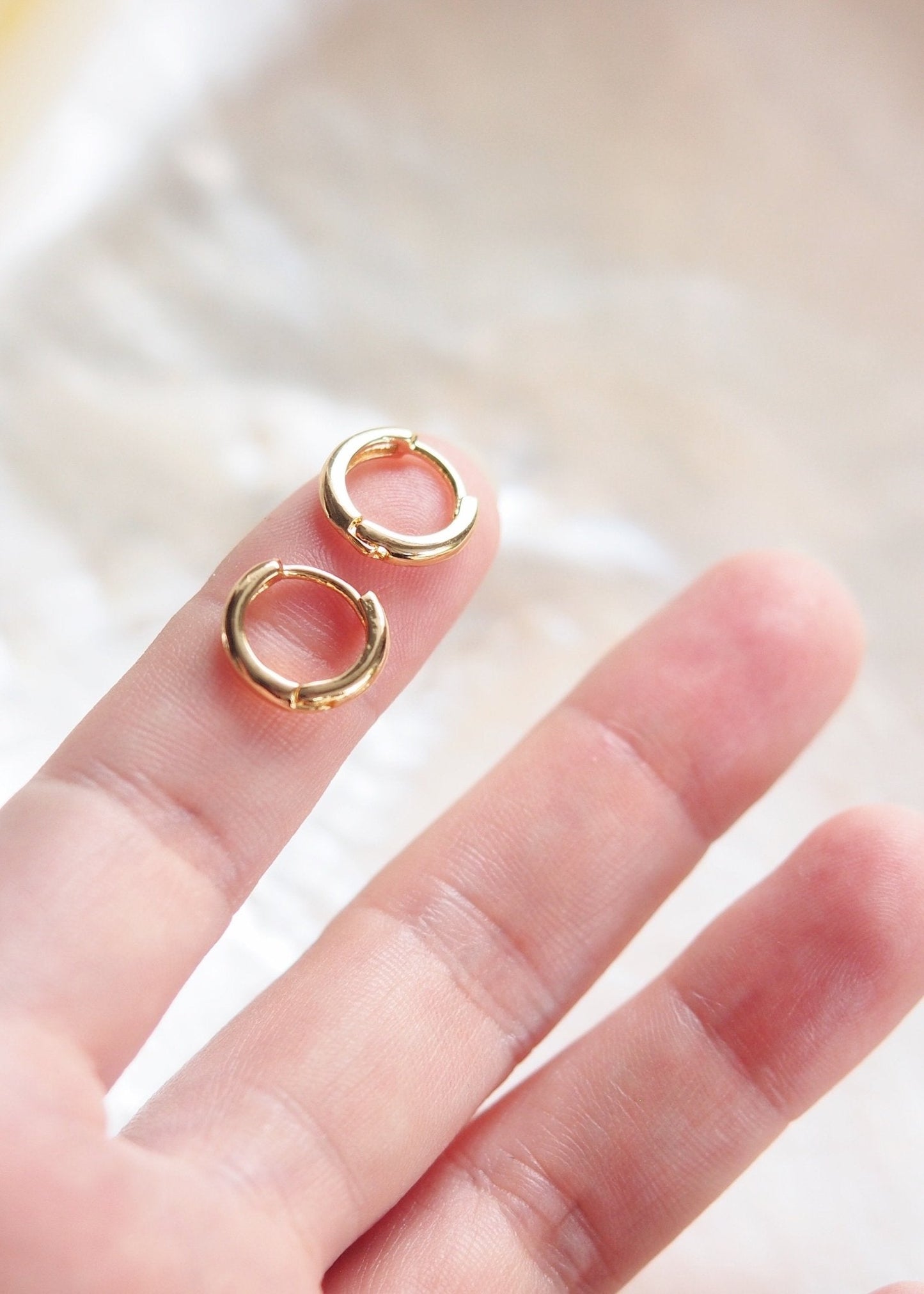 TINY GOLD HUGGIE HOOP EARRINGS - AUILI'I