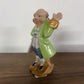 COLONIAL MAN WITH RAISED HAND IN A GREEN COAT- MADE IN JAPAN