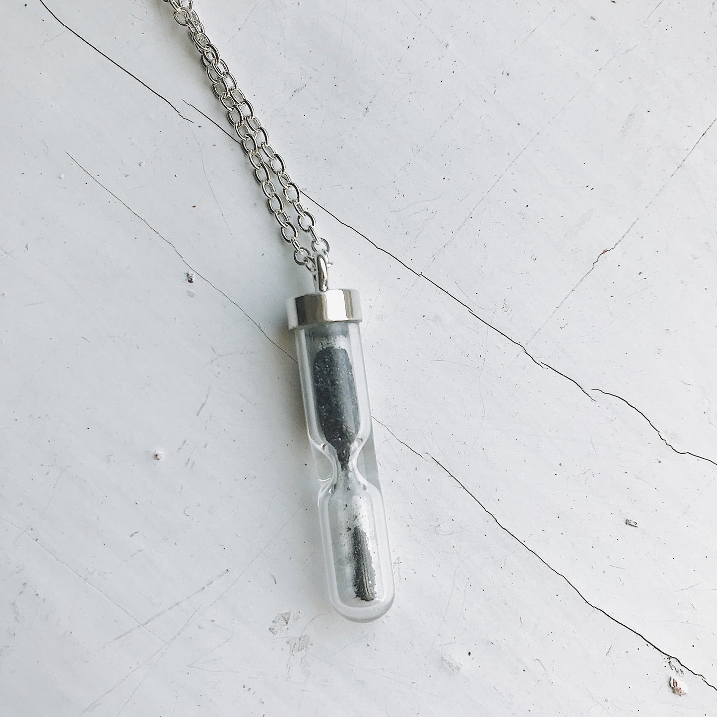 SPACE TIME HOURGLASS NECKLACE WITH METEORITE DUST