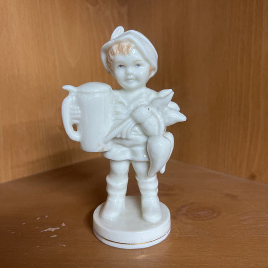 BOY WITH STEIN AND VEGETABLES IN WHITE GLAZE. JAPAN