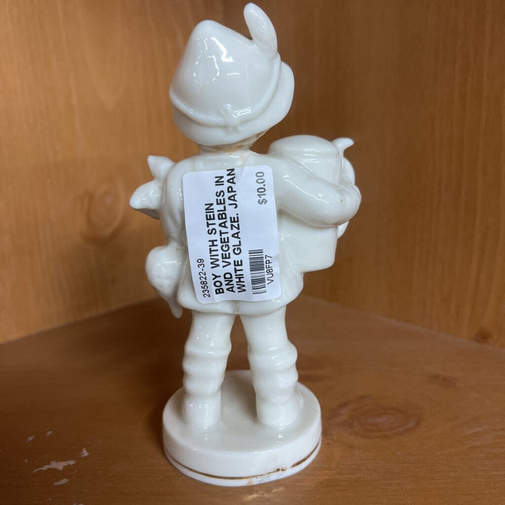 BOY WITH STEIN AND VEGETABLES IN WHITE GLAZE. JAPAN