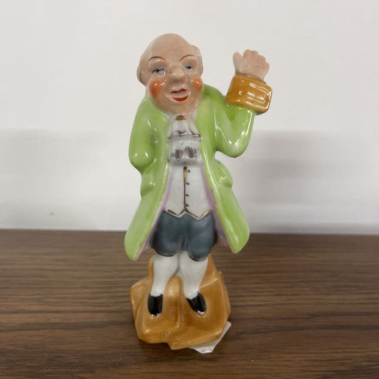 COLONIAL MAN WITH RAISED HAND IN A GREEN COAT- MADE IN JAPAN