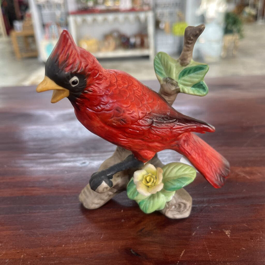 CERAMIC CARDINAL WITH YELLOW FLOWER FIGURINE