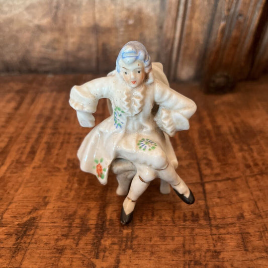 COLONIAL SITTING MAN FIGURINE