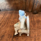 COLONIAL SITTING MAN FIGURINE