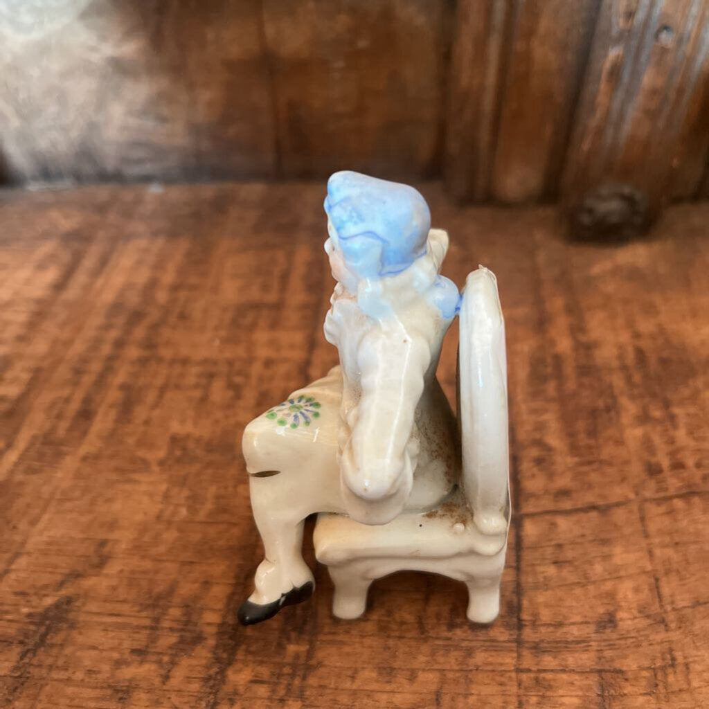 COLONIAL SITTING MAN FIGURINE