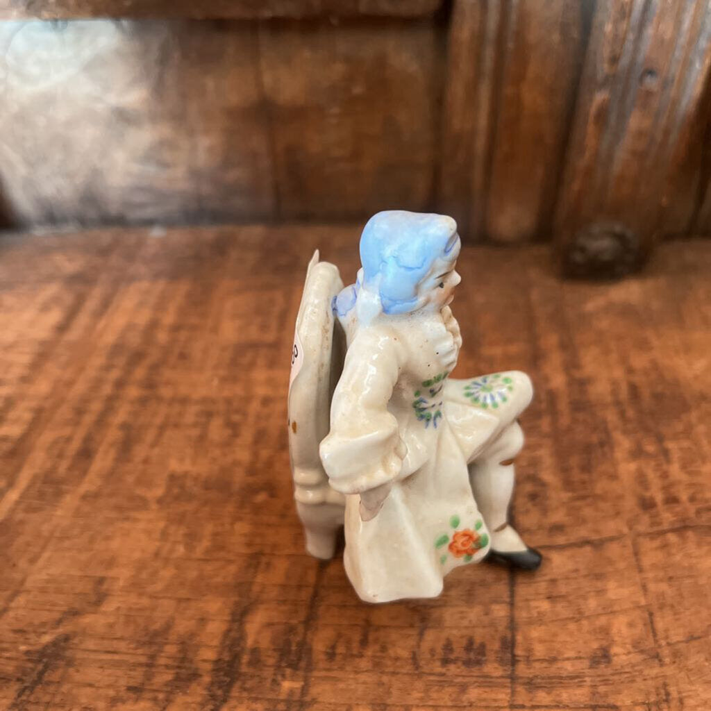 COLONIAL SITTING MAN FIGURINE