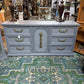 GREY BASSET 9 DRAWER WOODEN DRESSER