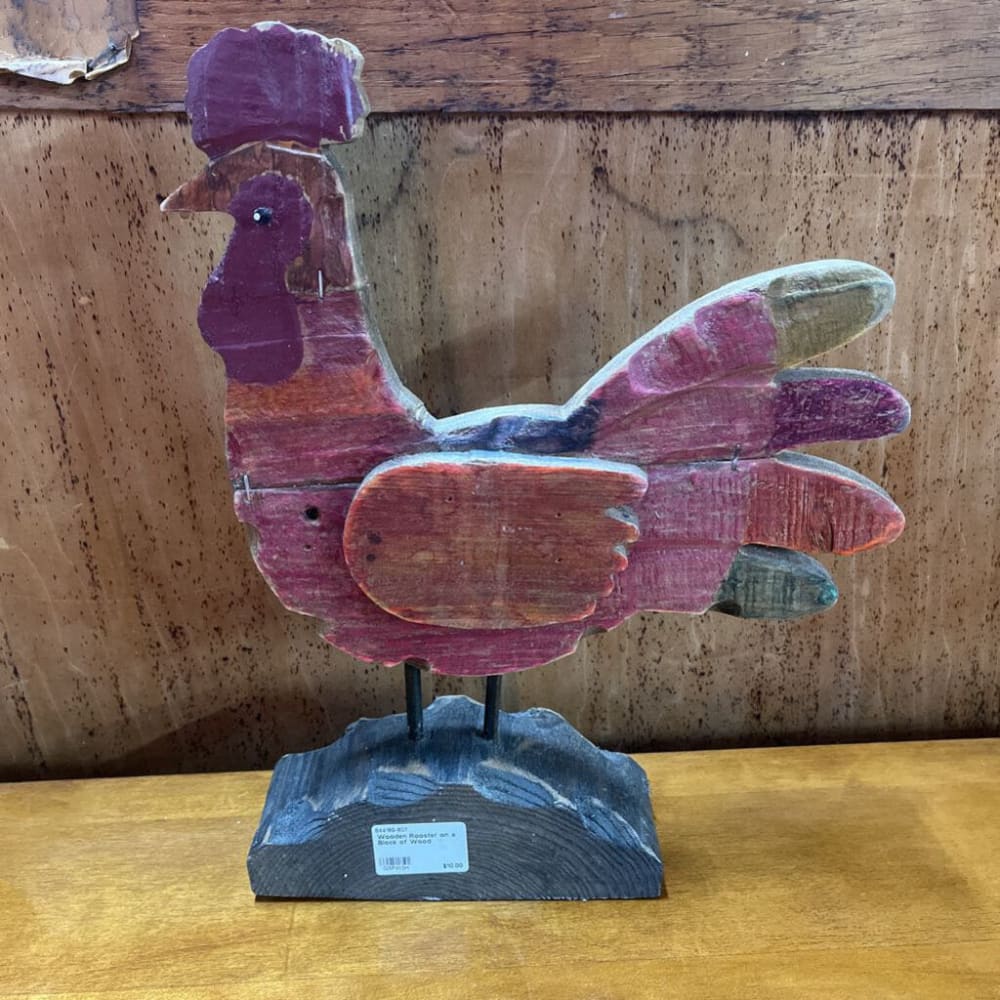 WOODEN ROOSTER ON A BLOCK OF WOOD