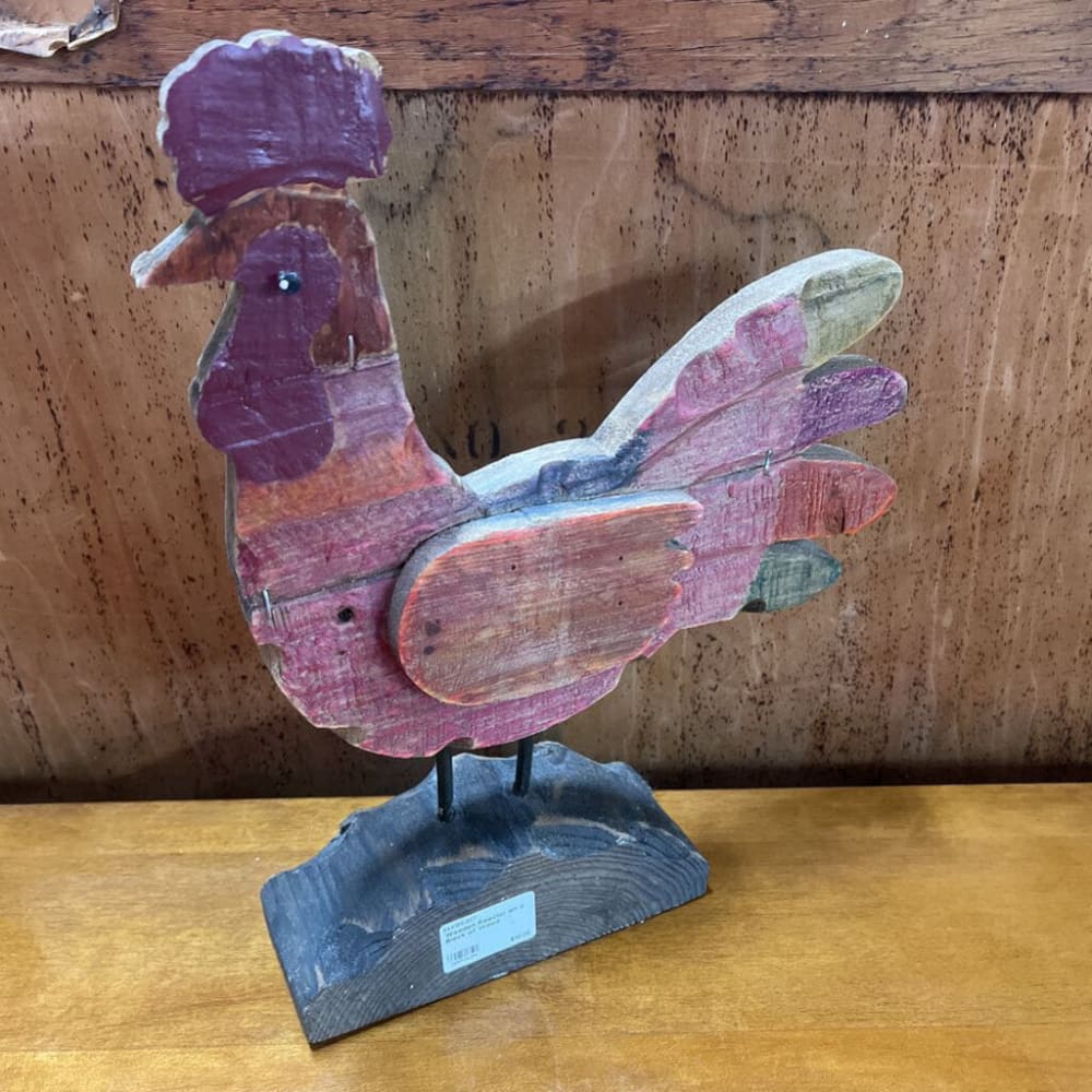 WOODEN ROOSTER ON A BLOCK OF WOOD