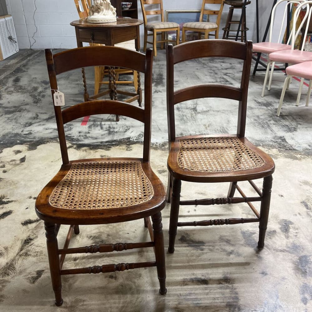 PAIR OF BROWN CANE CHAIRS