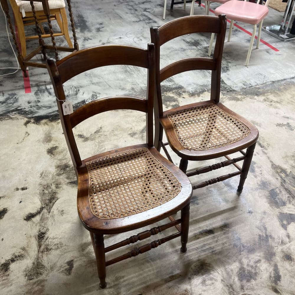 PAIR OF BROWN CANE CHAIRS