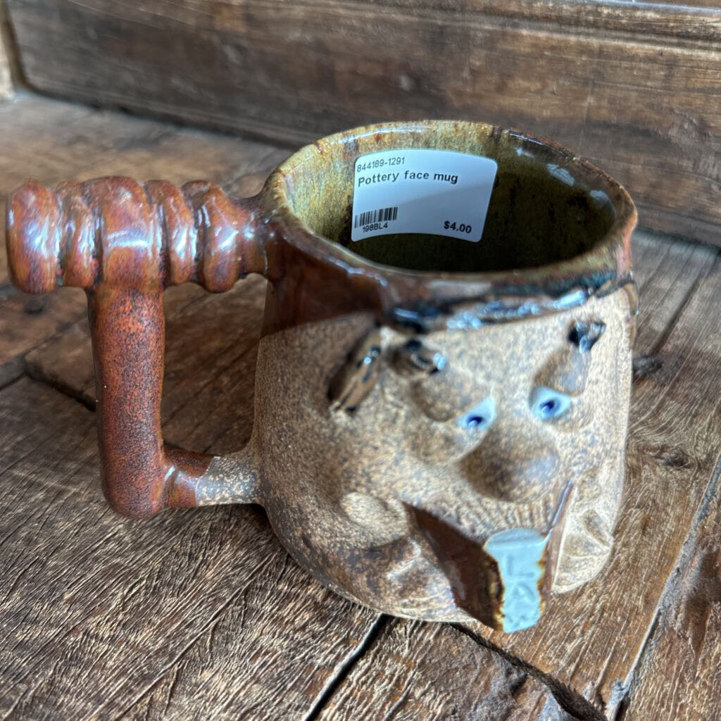 Pottery face mug