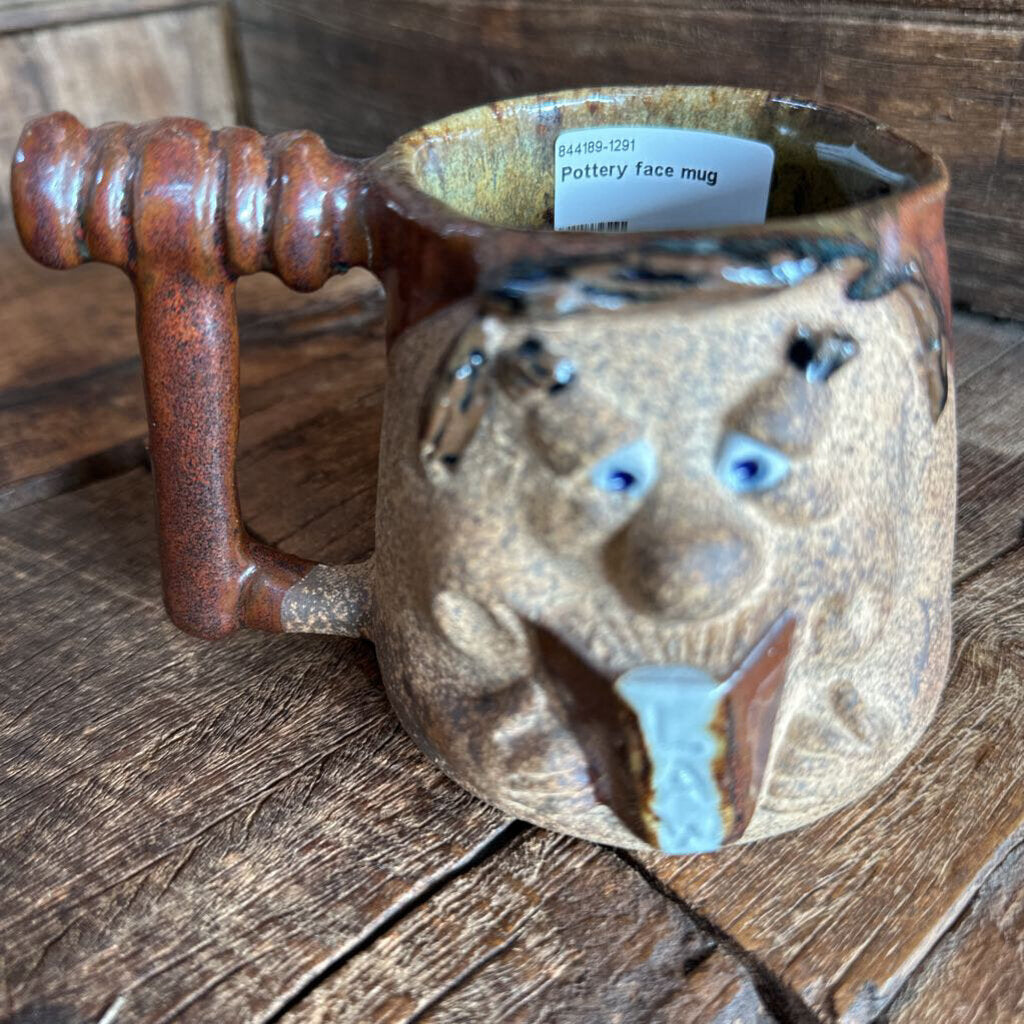 Pottery face mug