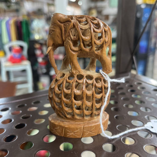 WOODEN CARVED ELEPHANT ON A BALL