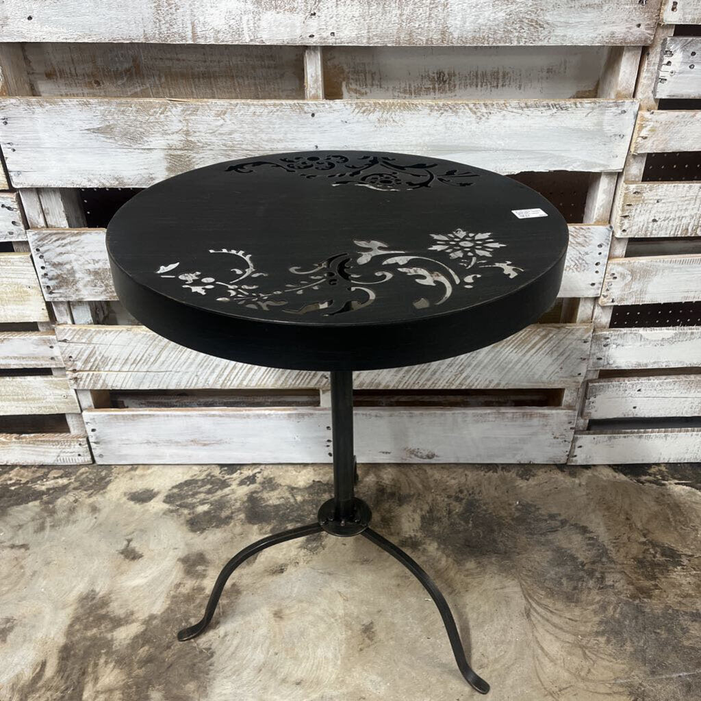 ROUND BLACK OUTDOOR TABLE WITH DECORATIVE CUTOUT DESIGN