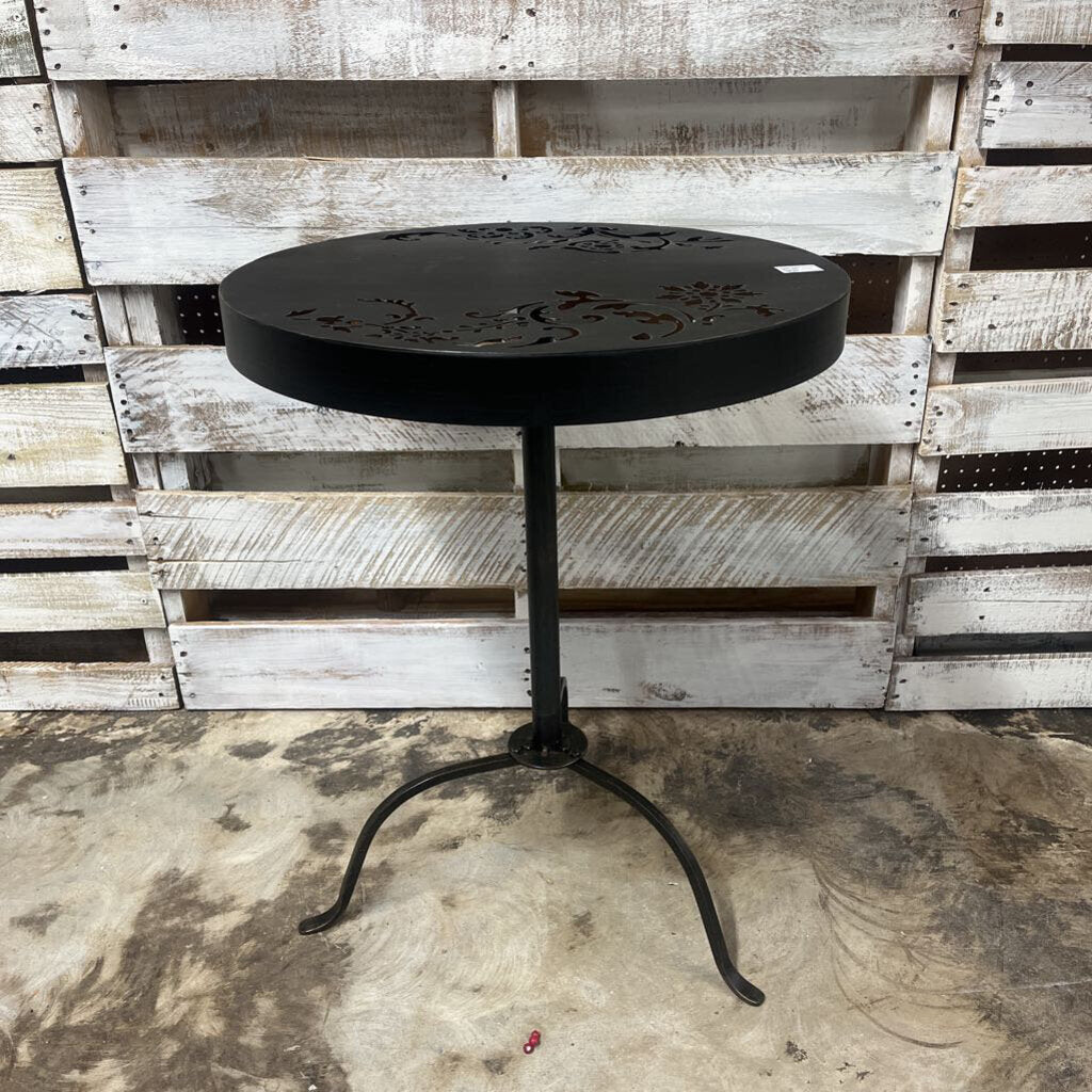 ROUND BLACK OUTDOOR TABLE WITH DECORATIVE CUTOUT DESIGN