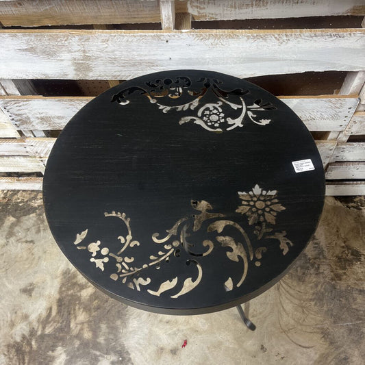 ROUND BLACK OUTDOOR TABLE WITH DECORATIVE CUTOUT DESIGN