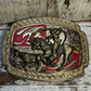 Riding Cowboy Goldtone Red Enamel Buckle