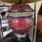 TABLE LAMP FEATURES A RED MOSAIC-TILED BASE, AND A CONICAL BLACK FABRIC LAMP SHADE