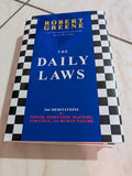 THE DAILY LAWS: 366 MEDITATIONS ON POWER, SEDUCTION, MASTERY, STRATEGY, AND HUMAN NATURE BOOK BY ROBERT GREENE