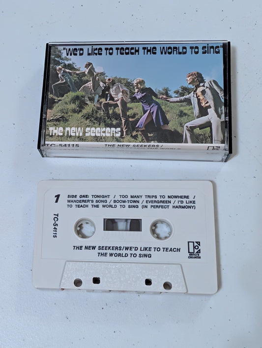 THE NEW SEEKERS - WE'D LIKE TO TEACH THE WORLD TO SING(CASSETTE, TAPE, ALBUM, MUSIC, VINTAGE, OOP)