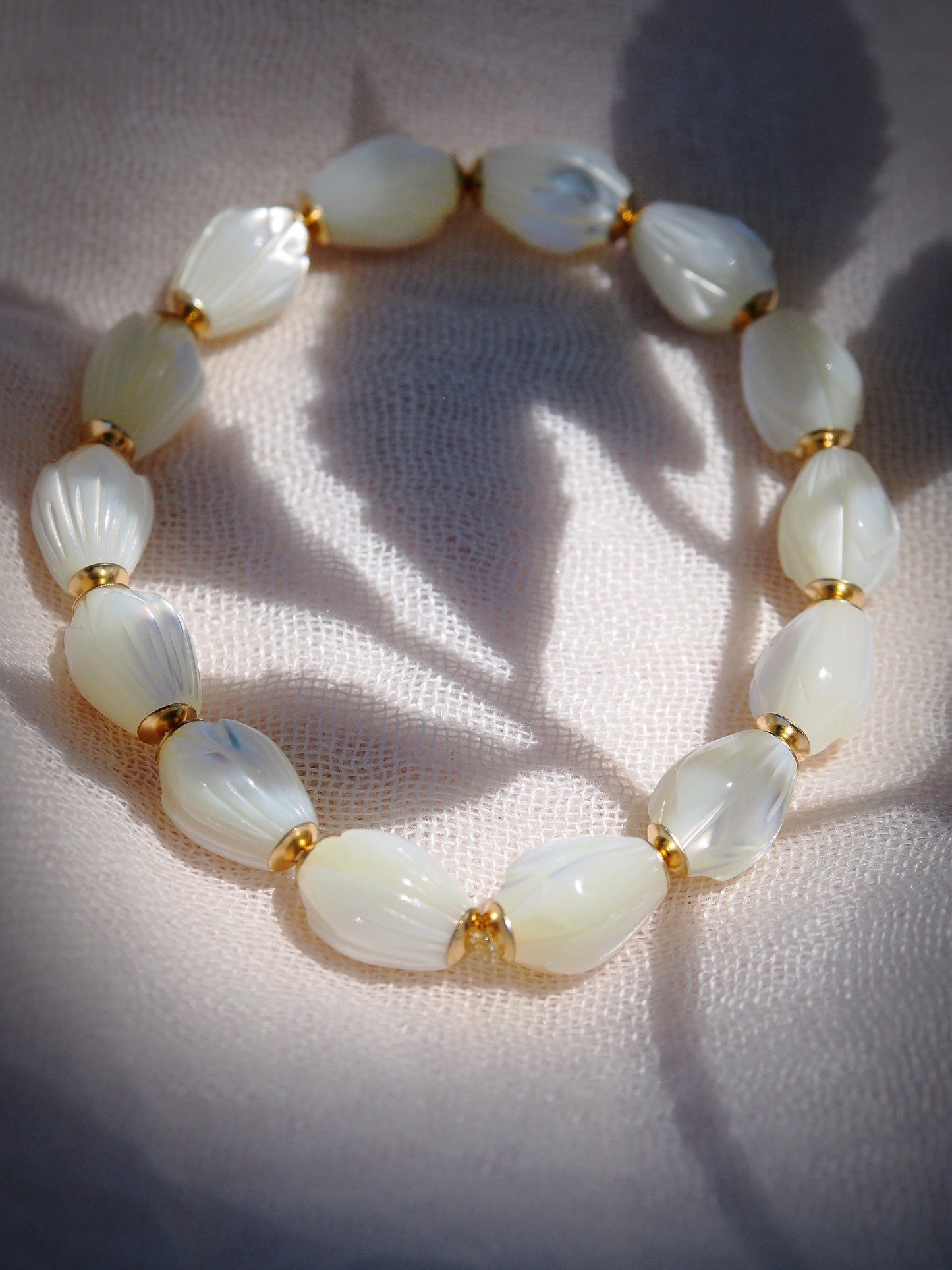 STRETCHY MOTHER OF PEARL PIKAKE BRACELET - ANELA