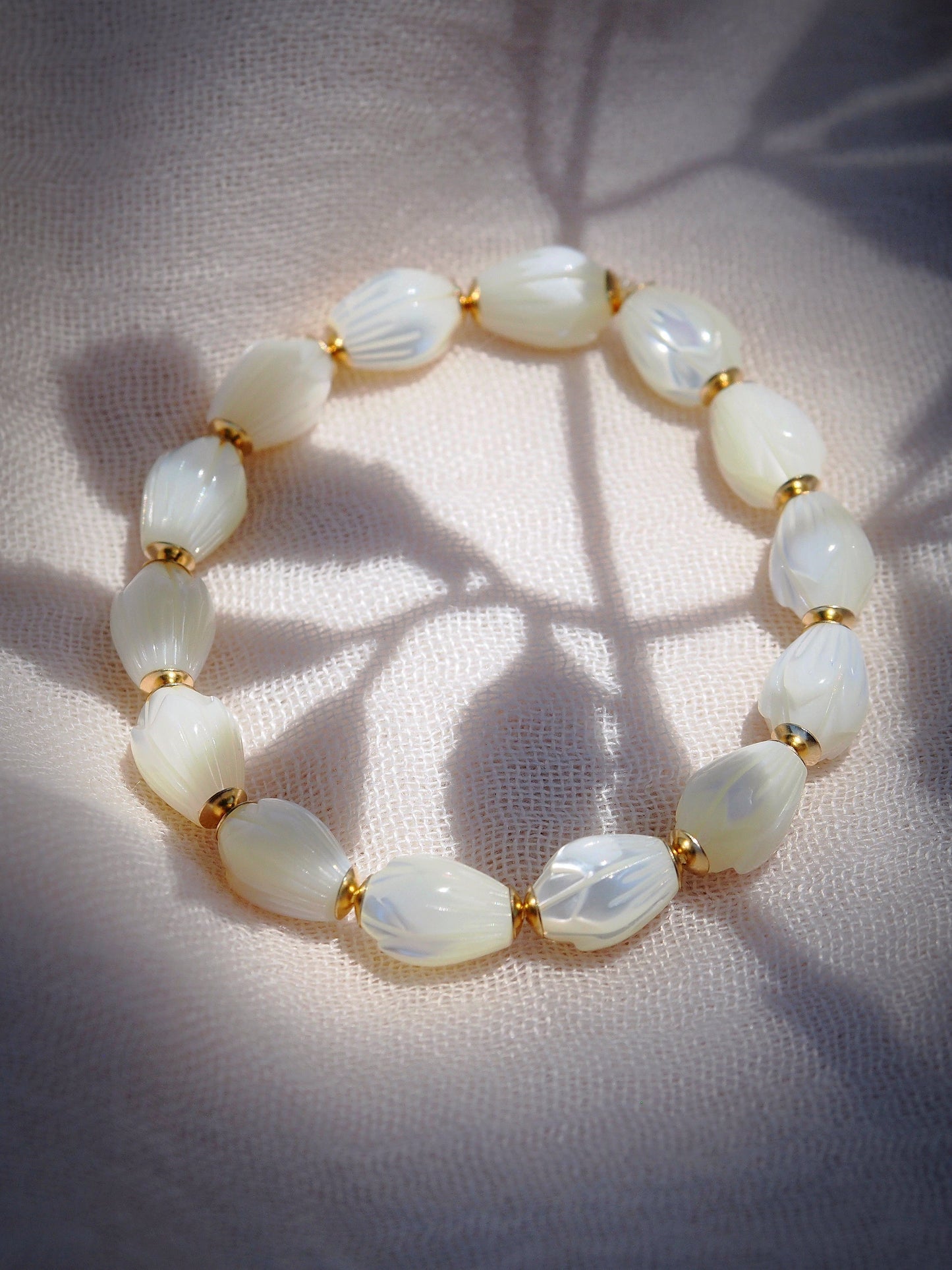 STRETCHY MOTHER OF PEARL PIKAKE BRACELET - ANELA
