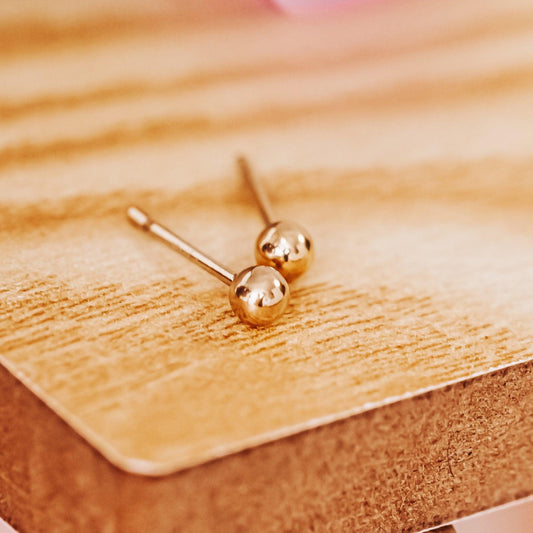 TINY GOLD BALL STUD EARRINGS