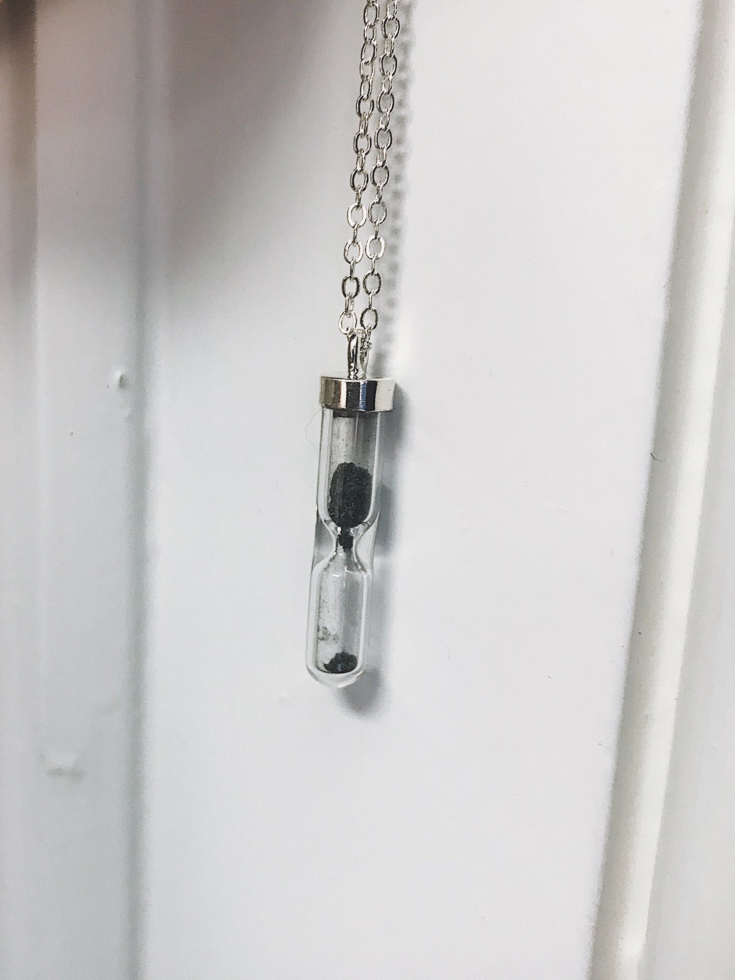 SPACE TIME HOURGLASS NECKLACE WITH METEORITE DUST